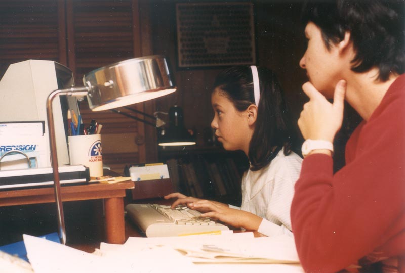 Mom helping Barb out with her homework.